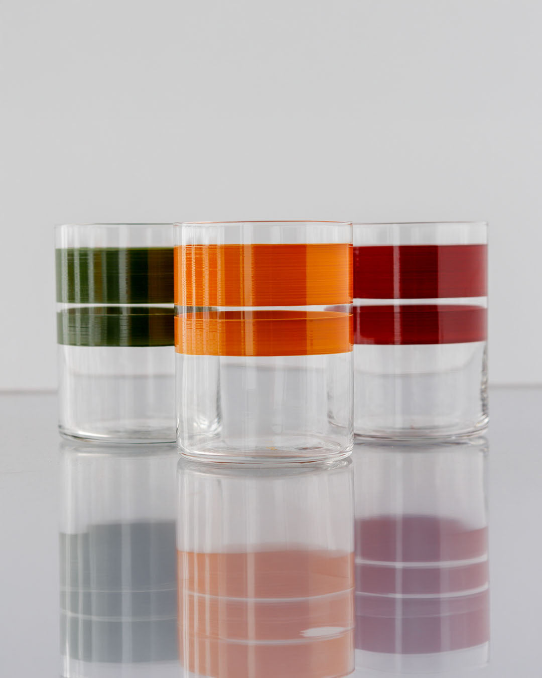 Portofino Sunset Tumblers · glassware hand-painted in green, raspberry and curry · Los Vasos de Agua Clara